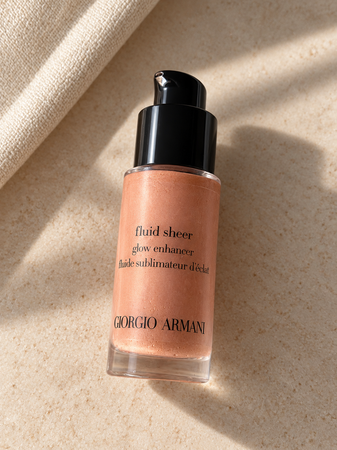 A bottle of Giorgio Armani Fluid Sheer complexion enhancer.